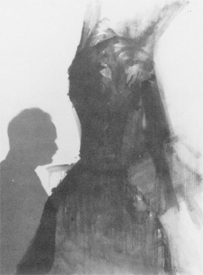 אורי ריזמן על רקע ציור, צילום: אליהו קוזלוב
